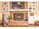 Inviting living room with brick fireplace, built-in shelves and hardwood floors at 351 Ridgewater Dr, Marietta, GA 30068