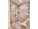 Shower featuring diagonally laid tiling, glass door, and shower head at 351 Ridgewater Dr, Marietta, GA 30068