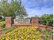 Stone monument sign for Indian Hills Country Club, surrounded by colorful flowers at 351 Ridgewater Dr, Marietta, GA 30068