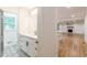 Bathroom with patterned tile flooring, white vanity, and matte black hardware at 418 Mockingbird, Smyrna, GA 30082