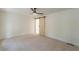 This is a large, well-lit bedroom with a ceiling fan and a sliding barn door at 418 Mockingbird, Smyrna, GA 30082