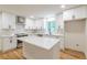 Modern kitchen featuring white cabinets, stainless appliances, and quartz countertops at 418 Mockingbird, Smyrna, GA 30082