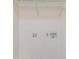 Laundry hookup with white walls and a wire shelf unit at 418 Mockingbird, Smyrna, GA 30082