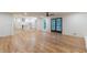 Open-concept living room showcases hardwood floors, a kitchen view, and sliding glass doors at 418 Mockingbird, Smyrna, GA 30082