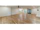 Large living room features hardwood floors, access to the kitchen, and natural lighting at 418 Mockingbird, Smyrna, GA 30082