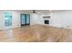 Expansive living room with hardwood floors, a whitewashed brick fireplace, and natural light at 418 Mockingbird, Smyrna, GA 30082