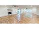 Spacious living room featuring wood floors, a whitewashed brick fireplace, and natural lighting at 418 Mockingbird, Smyrna, GA 30082