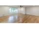 Spacious living room with hardwood floors and natural lighting from the large window at 418 Mockingbird, Smyrna, GA 30082