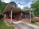 Charming brick home with covered porches and mature trees, offering a welcoming curb appeal at 8118 Sw Collier Sw St, Covington, GA 30014