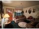 Comfortable living room with patterned sofas and decor, creating a cozy and inviting space at 8118 Sw Collier Sw St, Covington, GA 30014