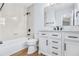 Beautiful bathroom with shower-over-tub, a granite-topped vanity and drawers for ample storage at 8914 Gardener Dr, Jonesboro, GA 30238