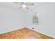 Clean bedroom with hardwood floors, neutral walls, and a window providing natural light creating a cozy atmosphere at 8914 Gardener Dr, Jonesboro, GA 30238