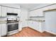 Well-equipped kitchen with stainless steel oven, granite countertops, and ample cabinet space at 8914 Gardener Dr, Jonesboro, GA 30238