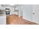 Bright kitchen view that showcases stainless steel appliances and ample wood floor space at 8914 Gardener Dr, Jonesboro, GA 30238