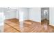 Inviting living room with hardwood floors and an open floor plan leading to the bathroom at 8914 Gardener Dr, Jonesboro, GA 30238