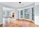 Open floor plan living room with fireplace and large windows allowing natural light to flood in at 8914 Gardener Dr, Jonesboro, GA 30238
