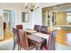 Dining room with hardwood floors, an elegant chandelier and adjacent living spaces at 1043 Elizabeth Ne Ct, Atlanta, GA 30306