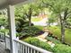 Scenic view from the porch with lush landscaping, stone steps, and mature trees at 1043 Elizabeth Ne Ct, Atlanta, GA 30306