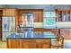 Spacious kitchen with wood cabinets, granite countertops, and stainless steel appliances at 1043 Elizabeth Ne Ct, Atlanta, GA 30306