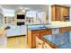 Open-concept kitchen with an island, stainless steel appliances, and adjacent living area at 1043 Elizabeth Ne Ct, Atlanta, GA 30306