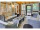 Inviting screened porch with wicker furniture, wood ceiling, and scenic views at 1043 Elizabeth Ne Ct, Atlanta, GA 30306
