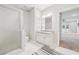 Modern bathroom with a glass shower, vanity with storage and a tiled floor at 2485 Millwater Xing, Dacula, GA 30019