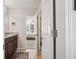 Bathroom featuring wood cabinets, granite countertops, with a view of the bedroom at 2485 Millwater Xing, Dacula, GA 30019