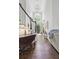 Inviting foyer featuring hardwood floors, high ceilings, and a view of the entrance at 2485 Millwater Xing, Dacula, GA 30019