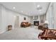 Bright living room with a fireplace, plush sofas, large windows and neutral paint tones at 2485 Millwater Xing, Dacula, GA 30019