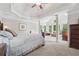 Spacious main bedroom with tray ceilings, sitting area, and lots of natural light at 2485 Millwater Xing, Dacula, GA 30019