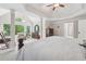Spacious main bedroom with tray ceilings, sitting area, and lots of natural light at 2485 Millwater Xing, Dacula, GA 30019