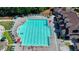 Large swimming pool area with ample seating and well-maintained landscaping at 2485 Millwater Xing, Dacula, GA 30019