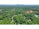Expansive aerial view showcasing the lush greenery and wooded surroundings of the property at 3267 Standing Peachtree Nw Trl, Kennesaw, GA 30152