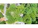 An aerial view of the property, surrounded by large trees at 3267 Standing Peachtree Nw Trl, Kennesaw, GA 30152