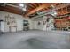 Spacious basement perfect for a workshop and features exposed ducts and wooden beams at 3267 Standing Peachtree Nw Trl, Kennesaw, GA 30152