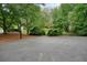 Outdoor basketball court surrounded by lush greenery provides recreation and entertainment at 3267 Standing Peachtree Nw Trl, Kennesaw, GA 30152