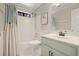 Bathroom featuring a shower-tub combo and vanity with a mint green storage unit at 3267 Standing Peachtree Nw Trl, Kennesaw, GA 30152