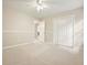 Bedroom featuring neutral walls, carpet, and double door closet for ample storage at 3267 Standing Peachtree Nw Trl, Kennesaw, GA 30152