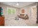 Bedroom featuring neutral walls, carpet, and furniture perfect for relaxing and reading at 3267 Standing Peachtree Nw Trl, Kennesaw, GA 30152
