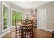 Bright breakfast nook with large windows offering scenic views of the outside at 3267 Standing Peachtree Nw Trl, Kennesaw, GA 30152