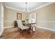 Traditional dining room featuring hardwood floors, chandelier, and elegant table set at 3267 Standing Peachtree Nw Trl, Kennesaw, GA 30152