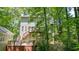 The home's exterior features a wood deck and stairs at 3267 Standing Peachtree Nw Trl, Kennesaw, GA 30152