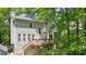 The home's exterior features a wood deck and stairs at 3267 Standing Peachtree Nw Trl, Kennesaw, GA 30152