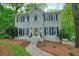 Charming two-story home with a brick facade and mature trees at 3267 Standing Peachtree Nw Trl, Kennesaw, GA 30152