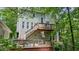 The home's exterior features a wood deck and stairs at 3267 Standing Peachtree Nw Trl, Kennesaw, GA 30152