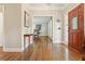 Inviting foyer with hardwood floors, elegant trim, and a view into a bright office space at 3267 Standing Peachtree Nw Trl, Kennesaw, GA 30152