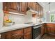 Close up of modern kitchen featuring tile backsplash and stainless steel appliances at 3267 Standing Peachtree Nw Trl, Kennesaw, GA 30152