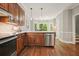 Bright, well-designed kitchen featuring wood cabinets and stainless appliances at 3267 Standing Peachtree Nw Trl, Kennesaw, GA 30152