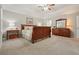 This main bedroom has neutral walls and carpet as well as wooden furniture at 3267 Standing Peachtree Nw Trl, Kennesaw, GA 30152