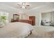 This main bedroom features neutral walls and carpet as well as a ceiling fan at 3267 Standing Peachtree Nw Trl, Kennesaw, GA 30152